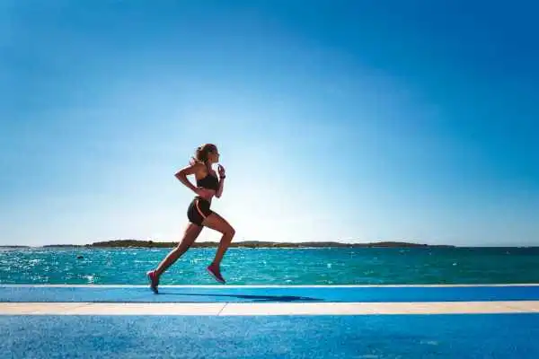 Woman running showing strong leg muscle Great Missenden